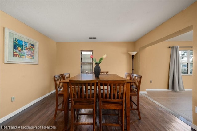 dining area featuring dark hardwood / wood-style floors