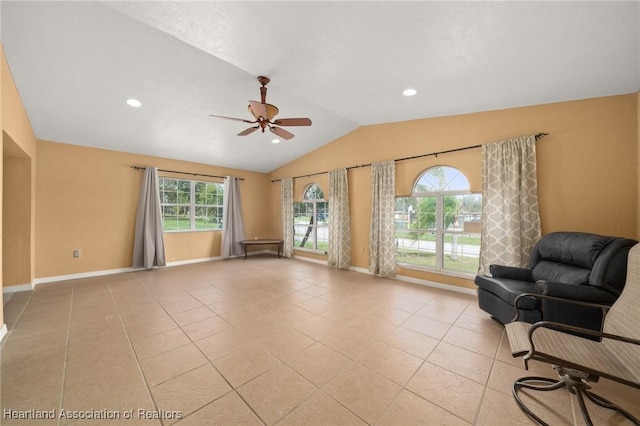 sitting room featuring light tile patterned floors, vaulted ceiling, and ceiling fan