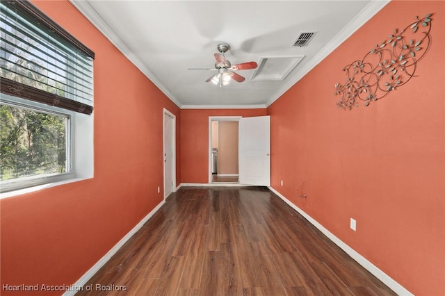 spare room with crown molding and hardwood / wood-style floors