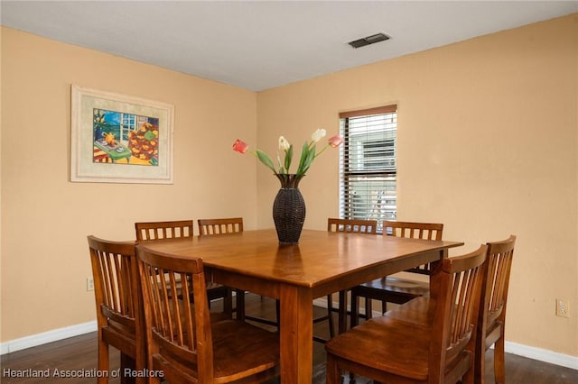 dining room featuring dark wood-type flooring