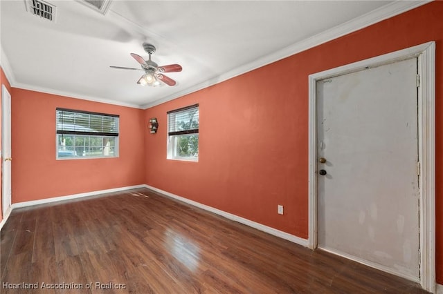 unfurnished room with ceiling fan, dark wood-type flooring, and ornamental molding