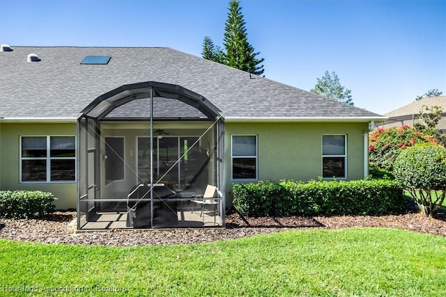 3045 Royal Oaks Ct, Sebring, FL 33875 - rear view of property with ceiling fan, a lawn, a shingled roof, and stucco siding