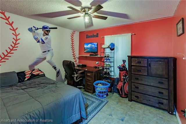 bedroom with ceiling fan and a textured ceiling