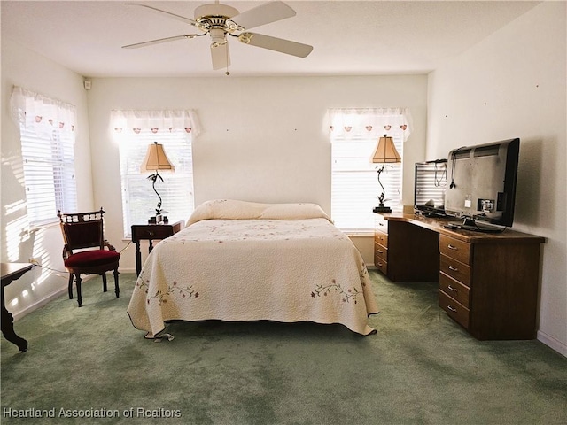 bedroom with ceiling fan and carpet