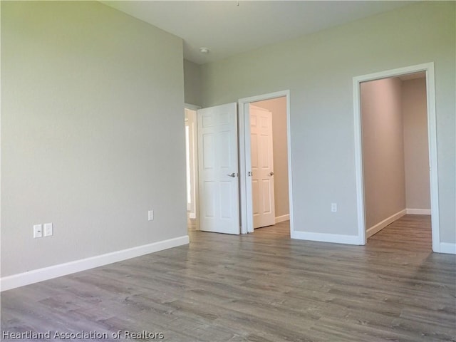 unfurnished bedroom featuring hardwood / wood-style floors