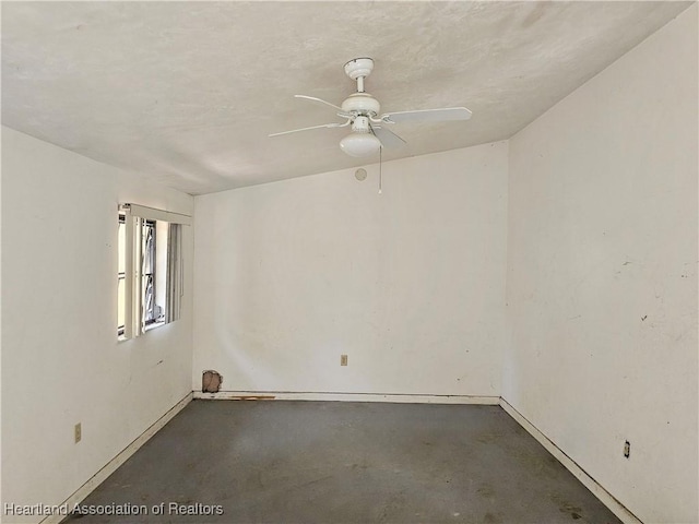 1237 Hitakee Ave, Sebring, FL 33870 - spare room with unfinished concrete flooring, a ceiling fan, and baseboards