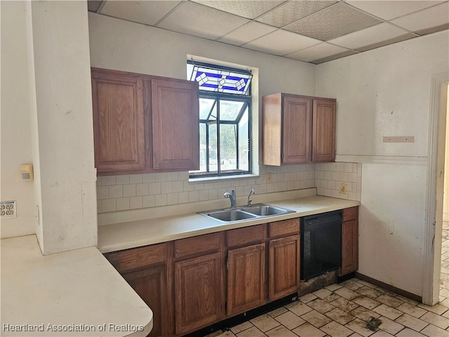 1237 Hitakee Ave, Sebring, FL 33870 - kitchen with a sink, black dishwasher, decorative backsplash, light countertops, and brown cabinets