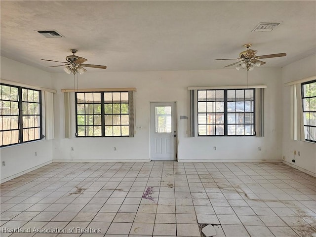 1237 Hitakee Ave, Sebring, FL 33870 - empty room featuring ceiling fan, baseboards, and light tile patterned floors