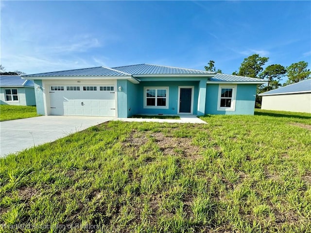 ranch-style home with a front yard and a garage