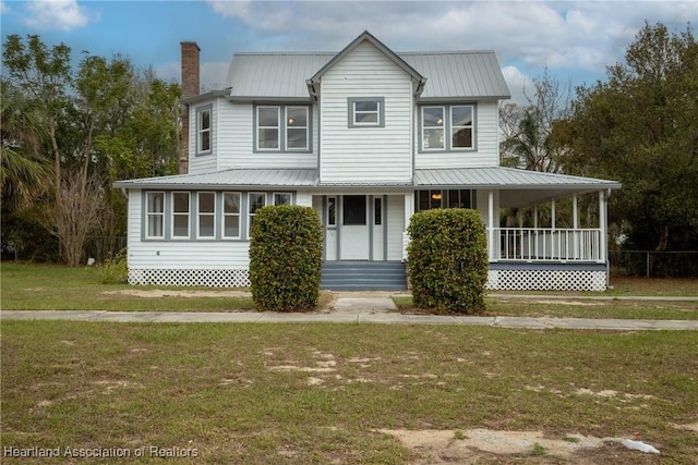 view of front of property with a porch and a front yard