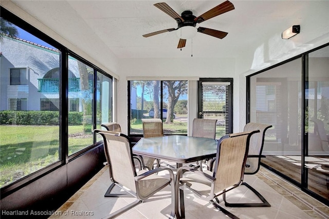 sunroom with ceiling fan and a healthy amount of sunlight