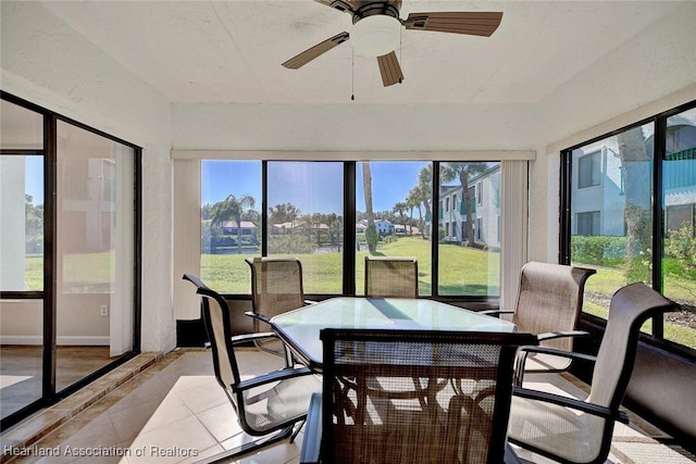 sunroom featuring ceiling fan