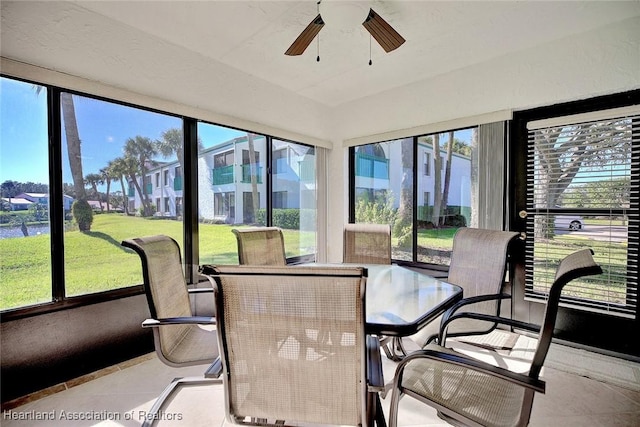 sunroom with a wealth of natural light and ceiling fan