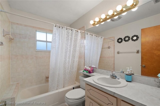 full bathroom featuring toilet, vanity, and shower / tub combo with curtain