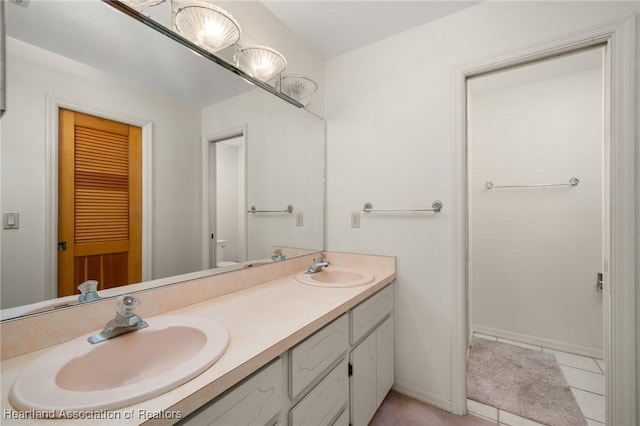 bathroom with vanity and tile patterned floors