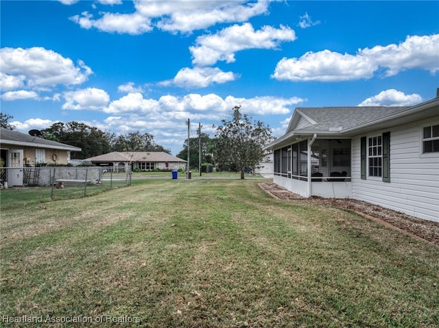 view of yard featuring a sunroom