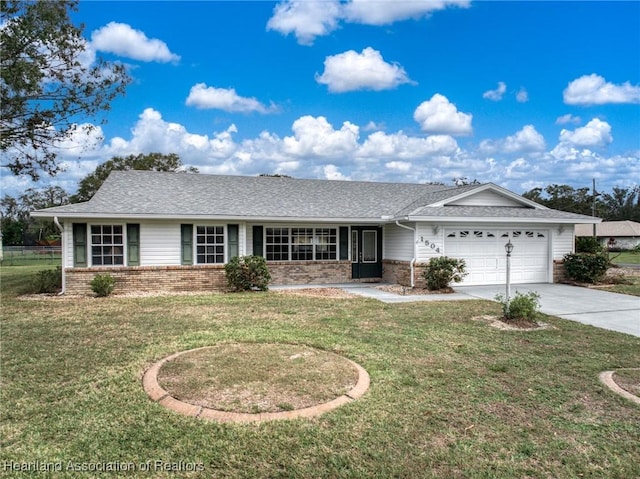 ranch-style home with a garage and a front lawn