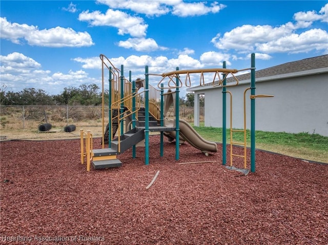 community jungle gym featuring fence