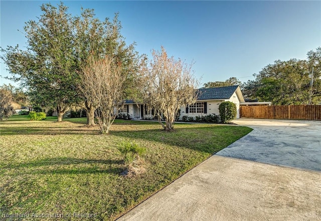 ranch-style house with a front lawn