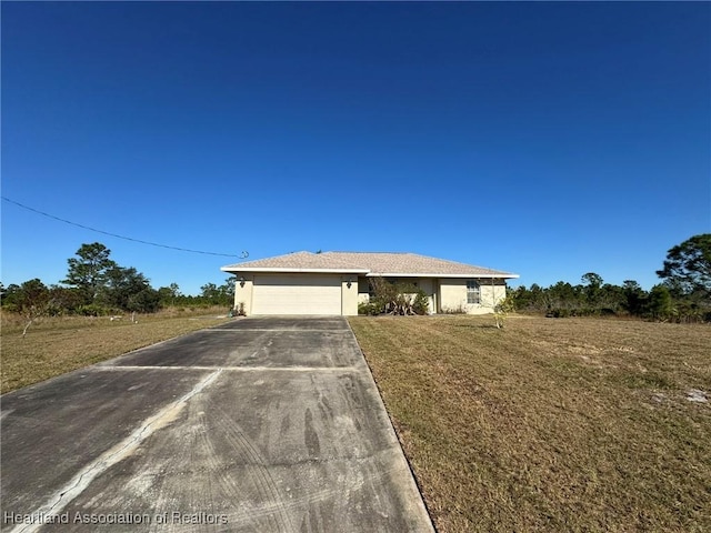 single story home with a garage and a front yard