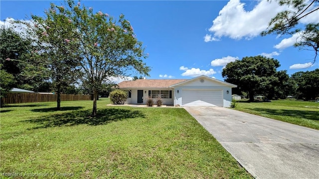 ranch-style home with a garage and a front lawn