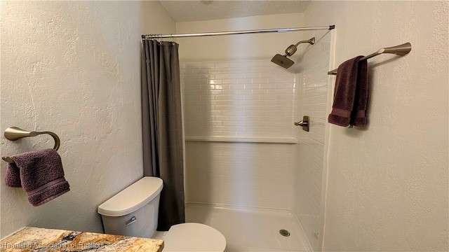 bathroom with a shower with shower curtain, a textured ceiling, and toilet