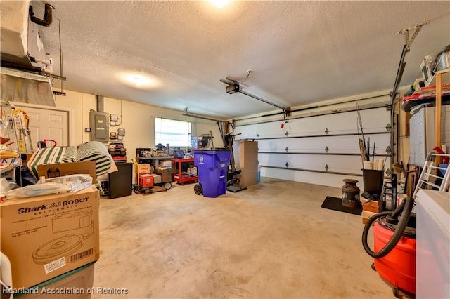 7700 Granada Rd, Sebring, FL 33876 - garage featuring electric panel and a garage door opener