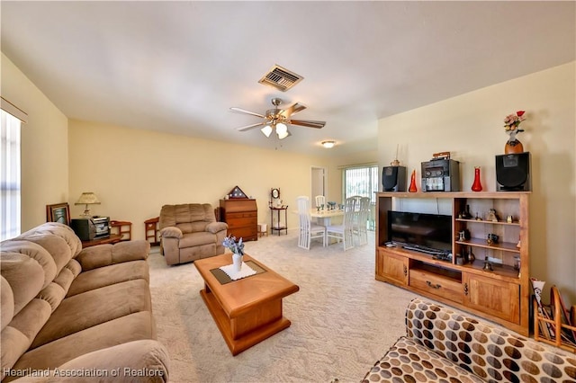 7700 Granada Rd, Sebring, FL 33876 - living area featuring carpet, visible vents, and ceiling fan