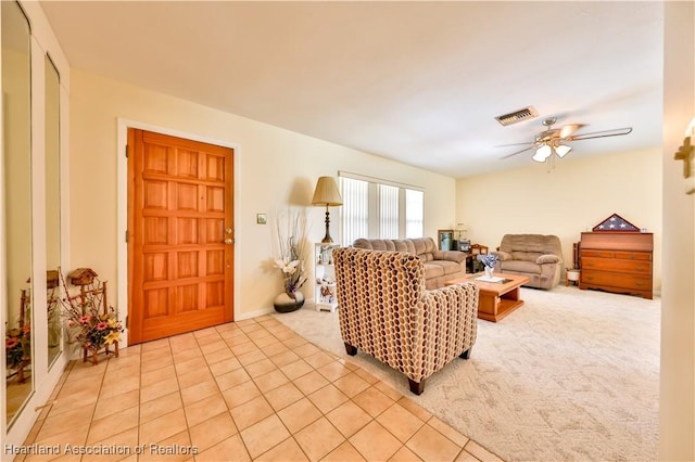 7700 Granada Rd, Sebring, FL 33876 - living room featuring visible vents, a ceiling fan, light colored carpet, and light tile patterned floors