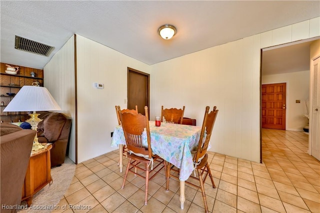 7700 Granada Rd, Sebring, FL 33876 - dining space with light tile patterned floors and visible vents