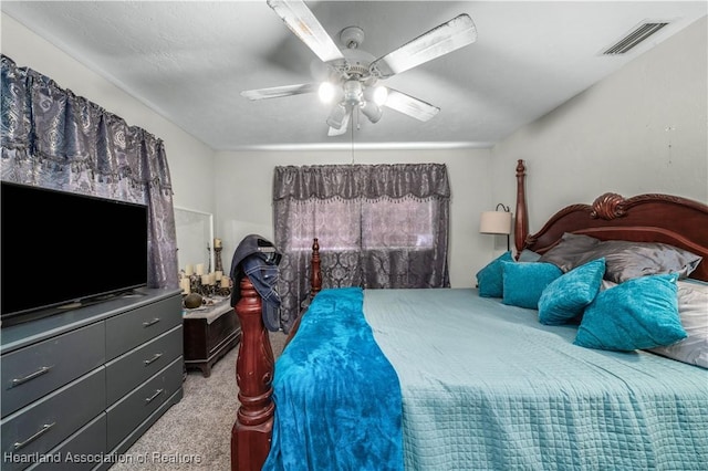 bedroom with ceiling fan and light colored carpet