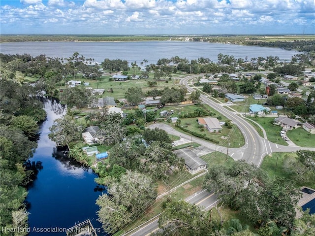 birds eye view of property with a water view