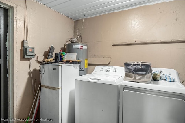 washroom with independent washer and dryer and water heater