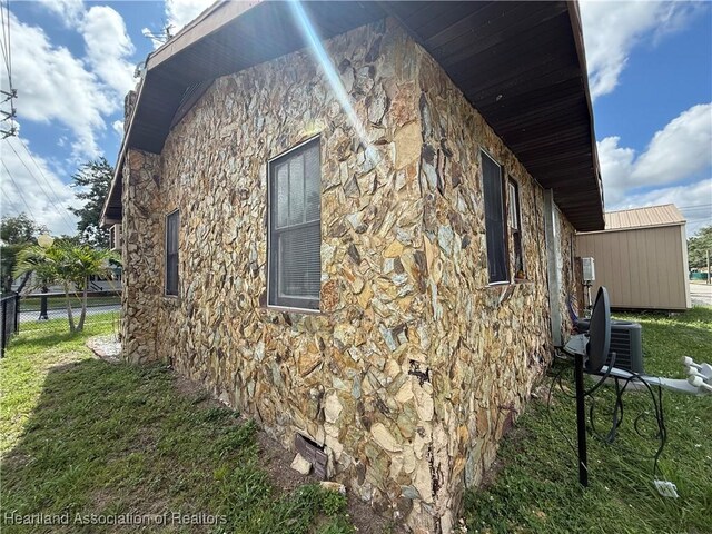 351 N Commerce Ave, Sebring, FL 33870 - view of home's exterior featuring stone siding