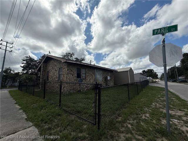 351 N Commerce Ave, Sebring, FL 33870 - view of home's exterior featuring stone siding