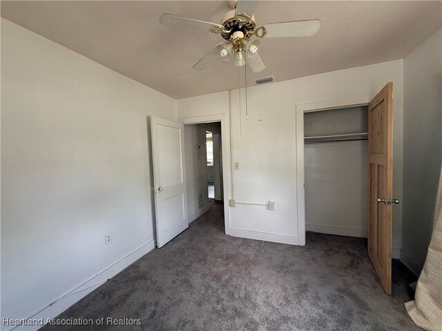 351 N Commerce Ave, Sebring, FL 33870 - unfurnished bedroom featuring carpet flooring, baseboards, a closet, and ceiling fan