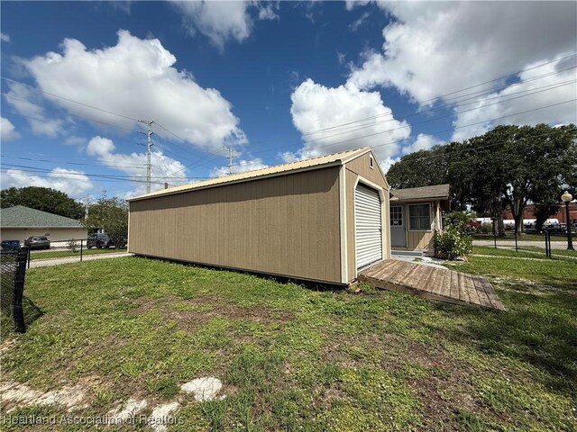 351 N Commerce Ave, Sebring, FL 33870 - view of side of home with an outbuilding and metal roof