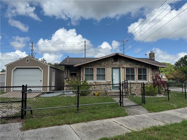 351 N Commerce Ave, Sebring, FL 33870 - view of front of house featuring a garage, a gate, a chimney, and an outdoor structure
