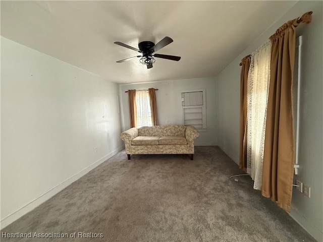 351 N Commerce Ave, Sebring, FL 33870 - living area with ceiling fan, carpet floors, and baseboards