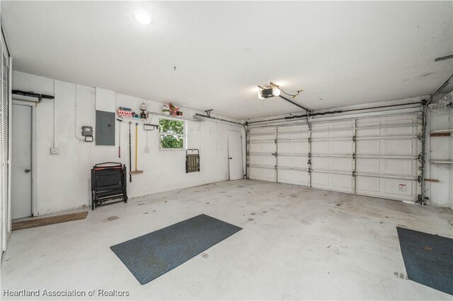 2407 Par Rd, Sebring, FL 33872 - garage featuring a garage door opener and electric panel