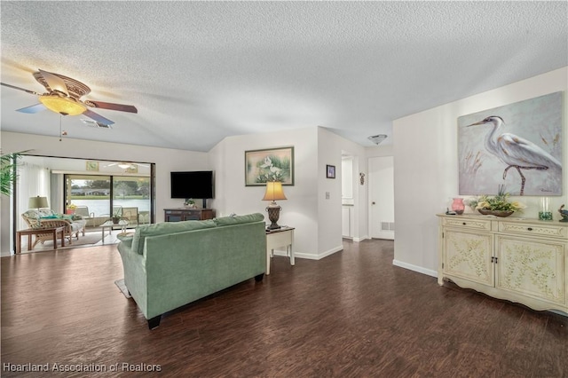 2407 Par Rd, Sebring, FL 33872 - living room with dark wood finished floors, visible vents, a ceiling fan, baseboards, and a textured ceiling