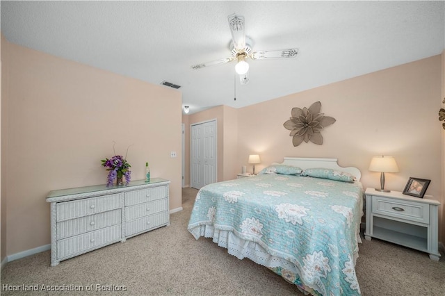 2407 Par Rd, Sebring, FL 33872 - carpeted bedroom with ceiling fan, baseboards, visible vents, and a closet