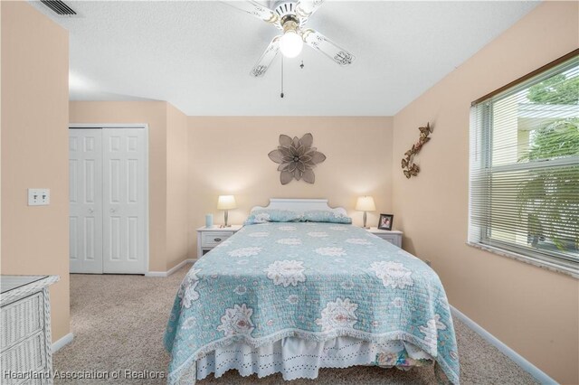 2407 Par Rd, Sebring, FL 33872 - carpeted bedroom featuring a closet, visible vents, a ceiling fan, and baseboards