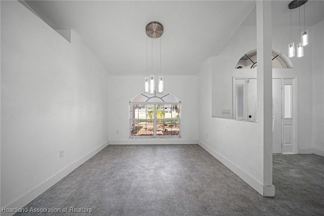 unfurnished dining area featuring carpet floors and baseboards