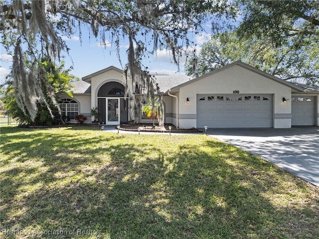 single story home with an attached garage, a front lawn, stucco siding, and concrete driveway