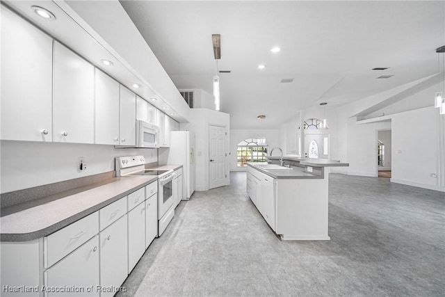 kitchen featuring a sink, white cabinets, white appliances, and decorative light fixtures