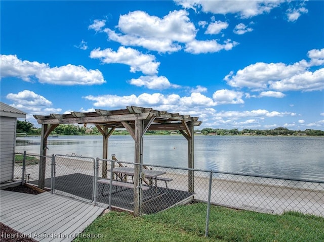 dock area with a water view and a pergola