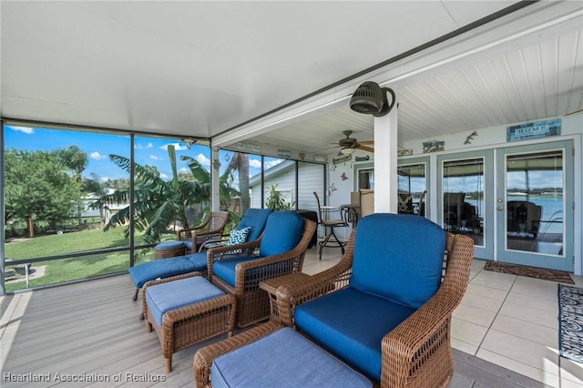 sunroom featuring ceiling fan