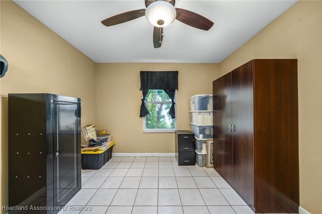 kitchen featuring ceiling fan and light tile patterned flooring