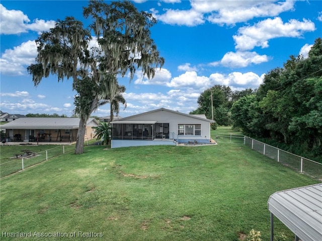 view of yard featuring a sunroom